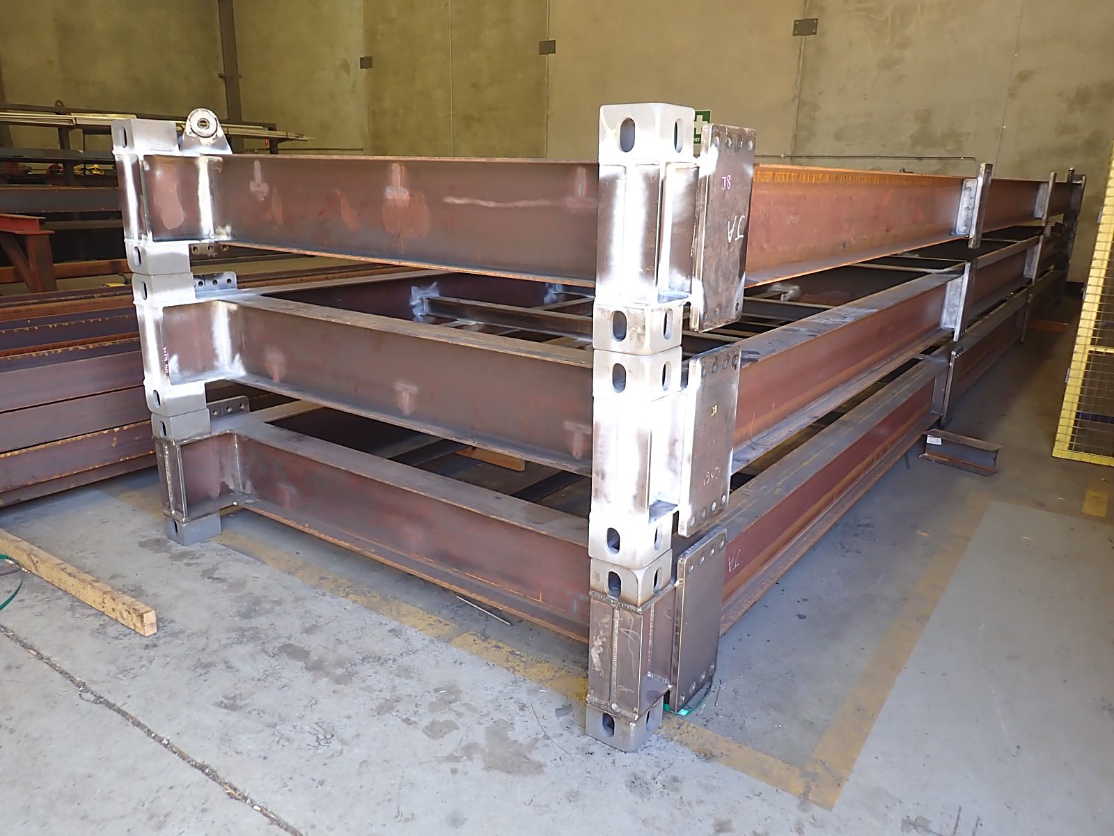 Fabricated structural steel frames stacked in the GRS workshop